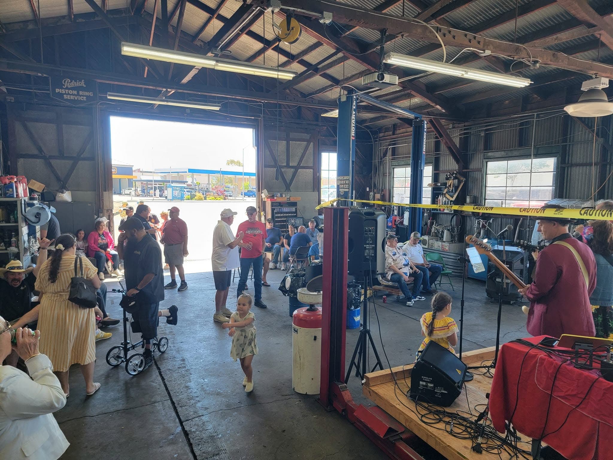 Accu-Line's anniversary party in the shop, with a live band and a child dancing