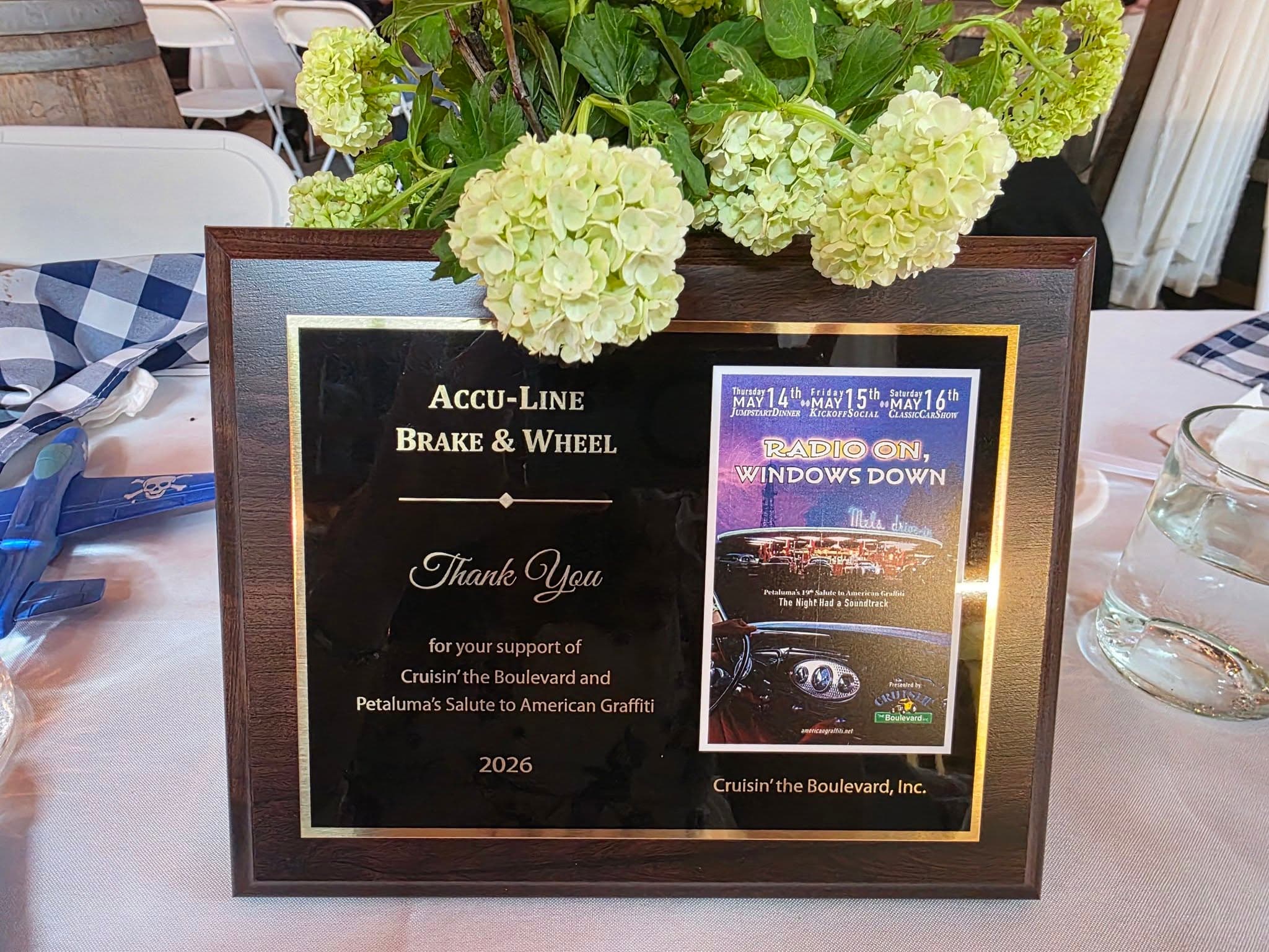 A plaque thanking Accu-Line Brake & Wheel for supporting Cruisin' the Boulevard and Petaluma's Salute to American Graffiti